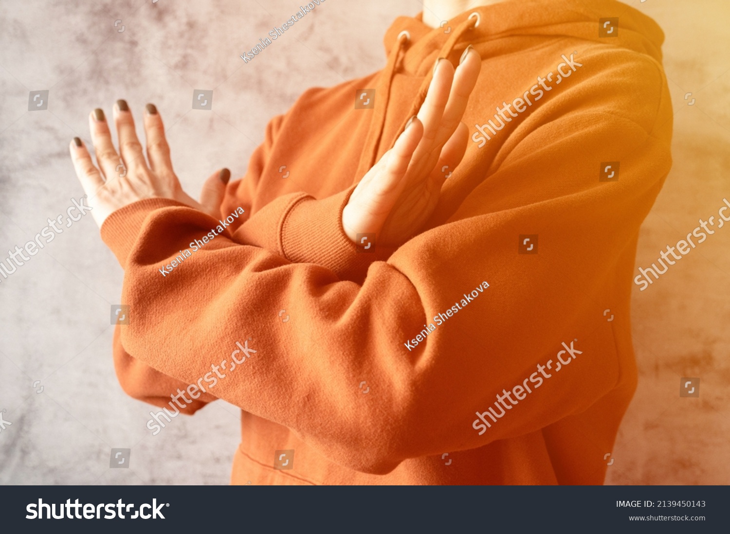 young-woman-arms-crossed-chest-demonstrates-stock-photo-2139450143