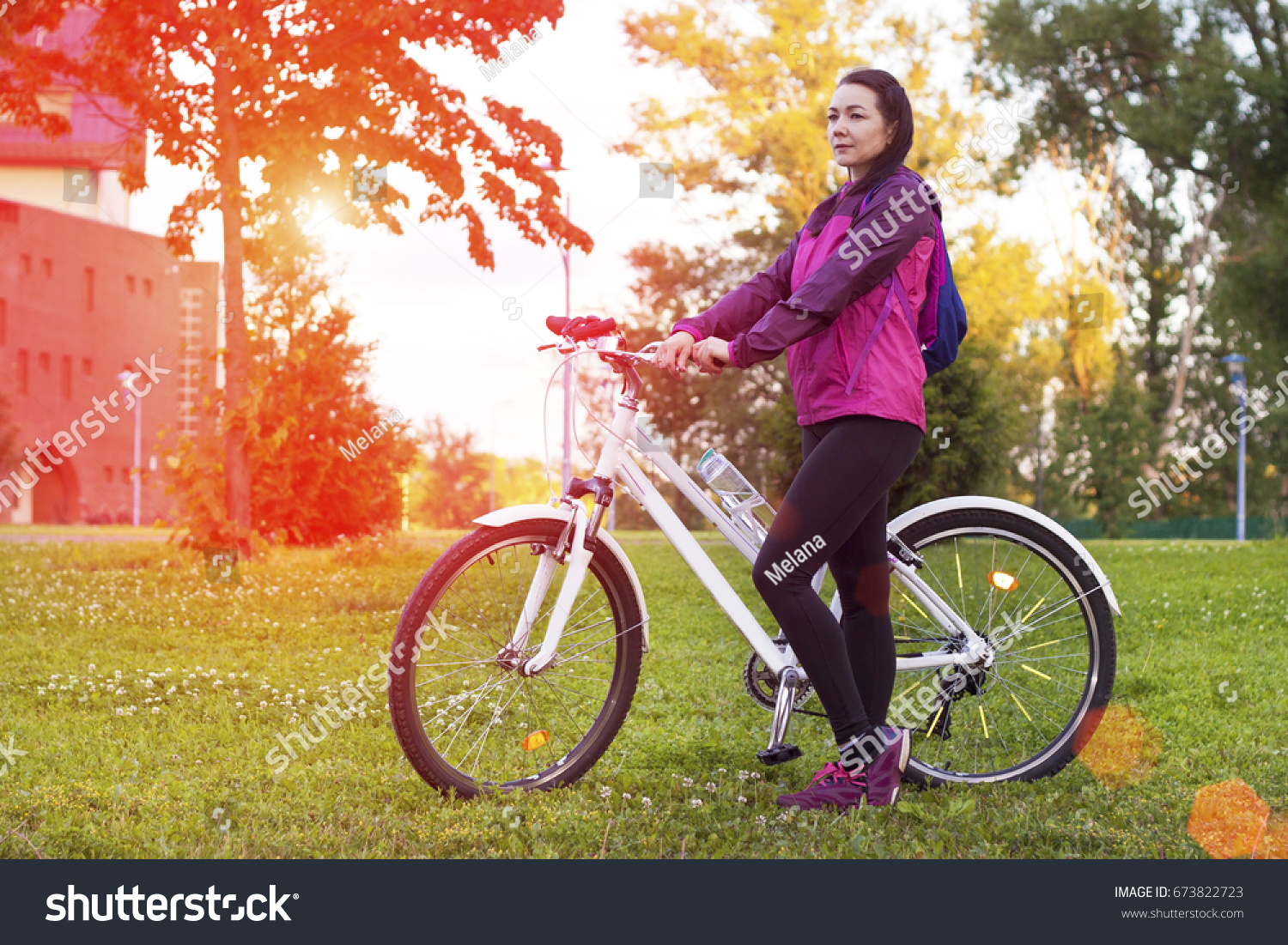 woman sun bicycles