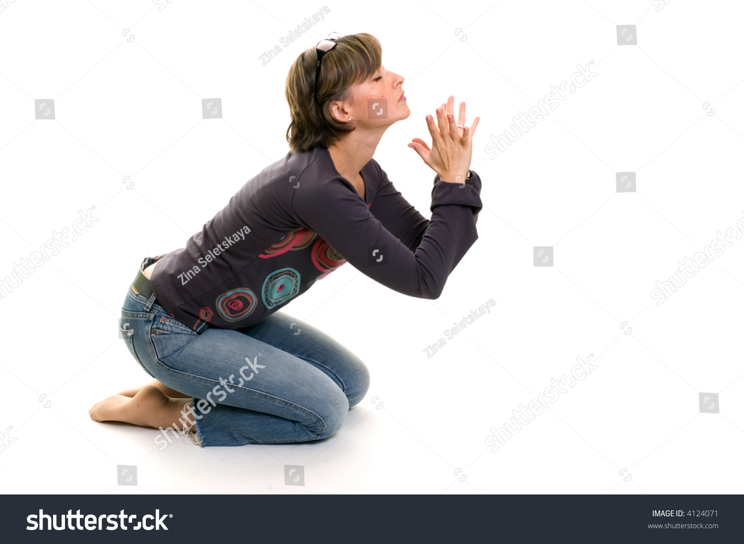 Woman Praying On Her Knees