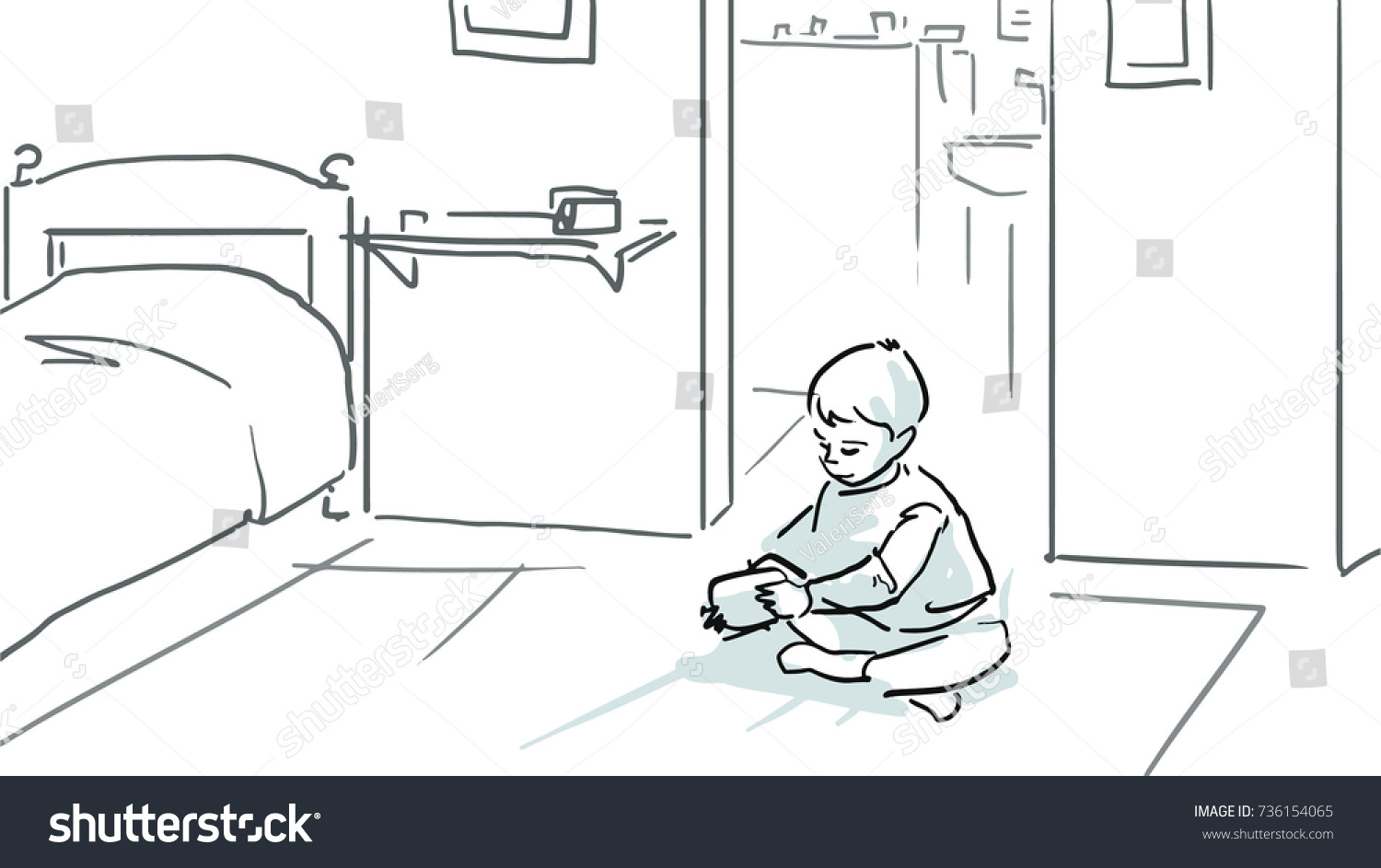 A little boy is sitting on a floor in a room and playing black and white