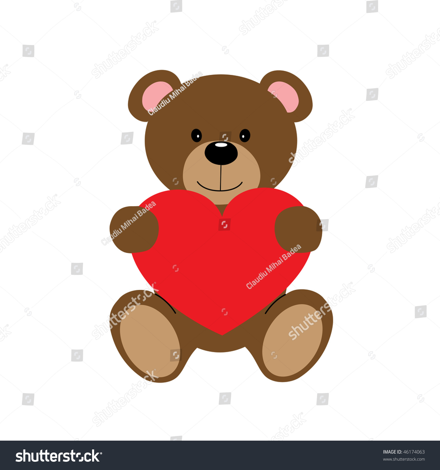 small teddy bear holding heart